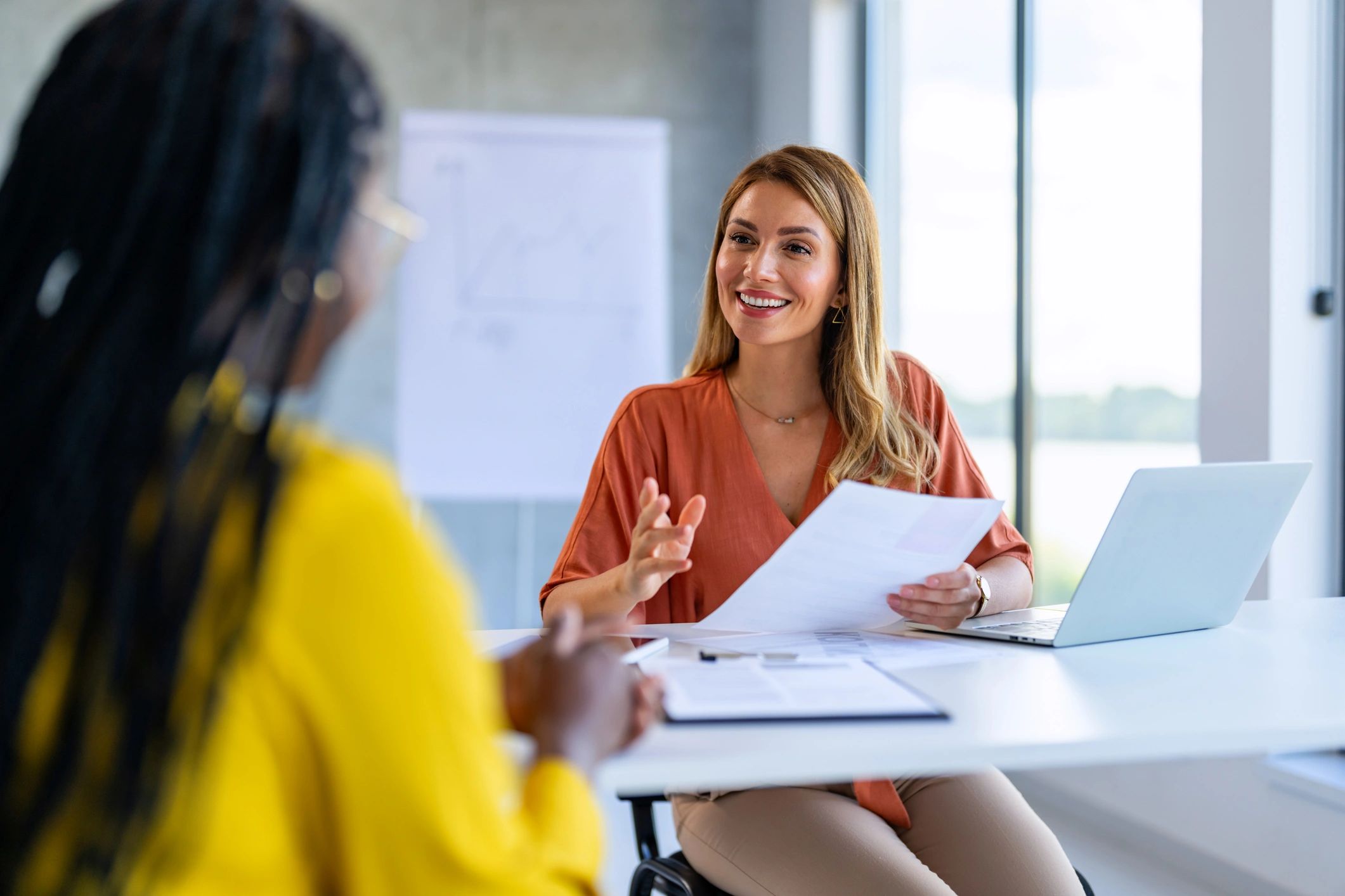 Accountant meeting with a client to review documents and provide advice