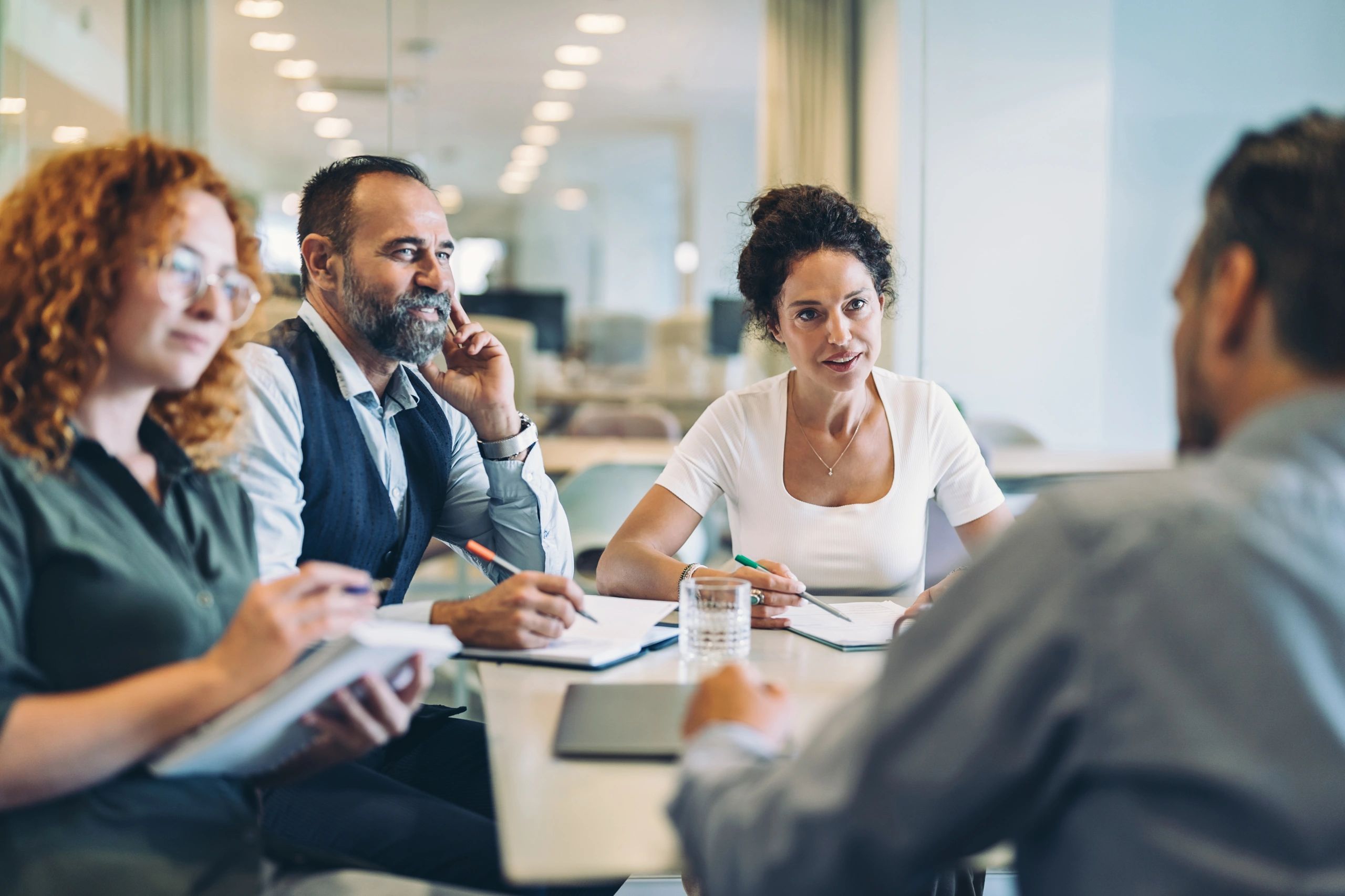 Business meeting representing record-keeping and compliance
